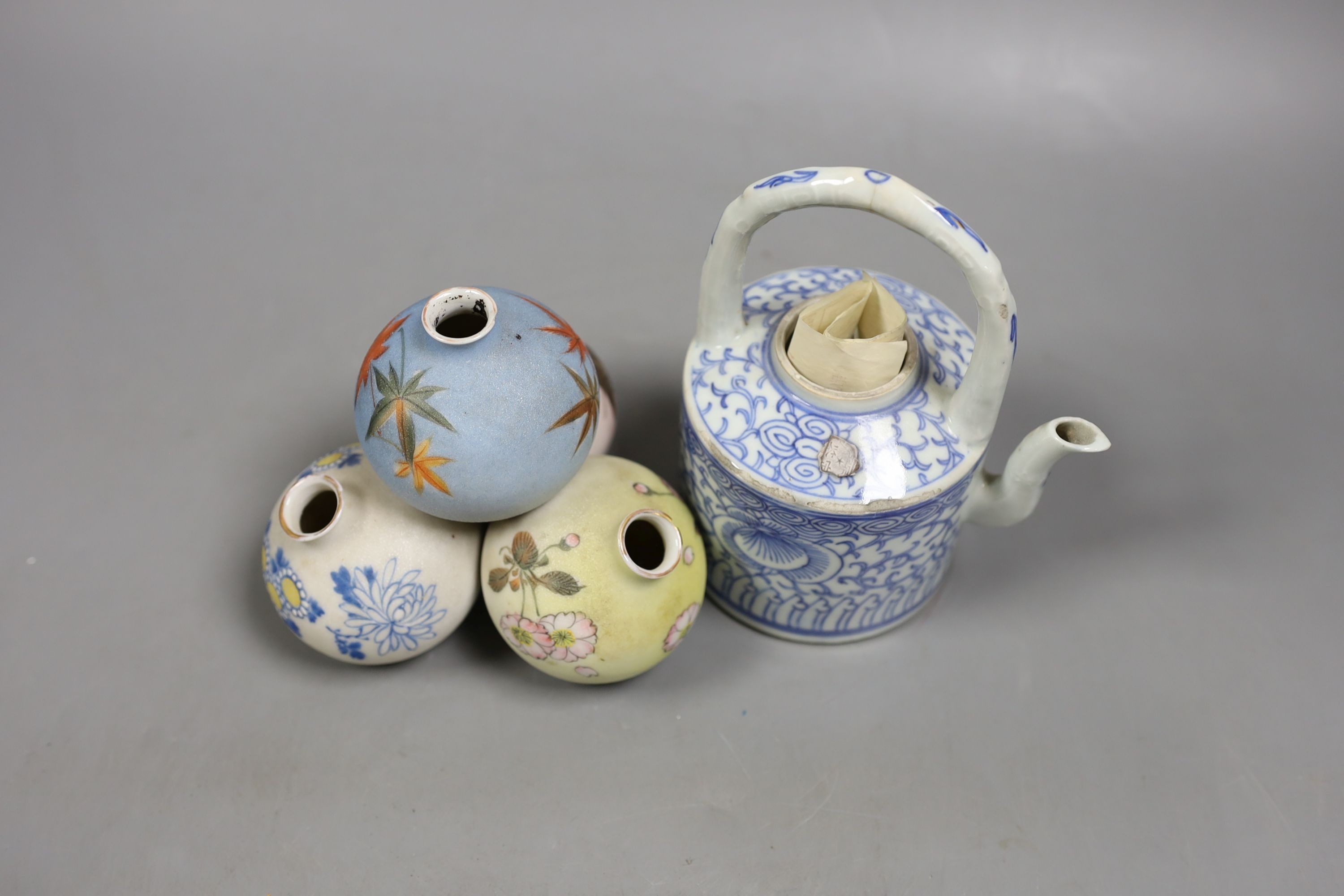 A Chinese blue and white teapot - no cover and a Japanese multiple globular posy vase, Teapot 15 cms high including handle.